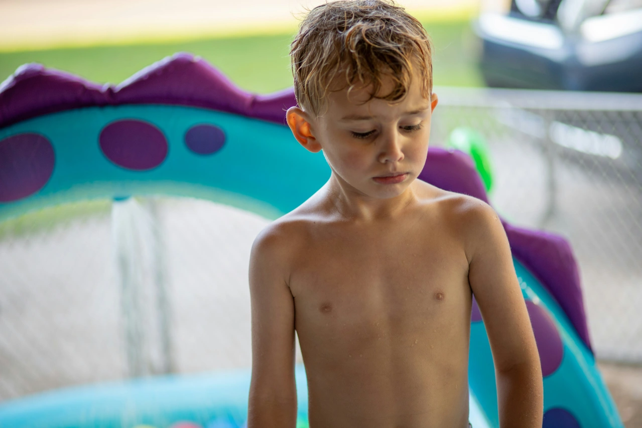 Upset boy infront of football goal